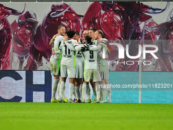 Joakim Maehle of VfL Wolfsburg  celebrates the teams fourth goal during the Bundesliga match between RB Leipzig and VfL Wolfsburg at Red Bul...