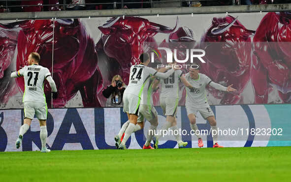 Joakim Maehle of VfL Wolfsburg  celebrates the teams fourth goal during the Bundesliga match between RB Leipzig and VfL Wolfsburg at Red Bul...