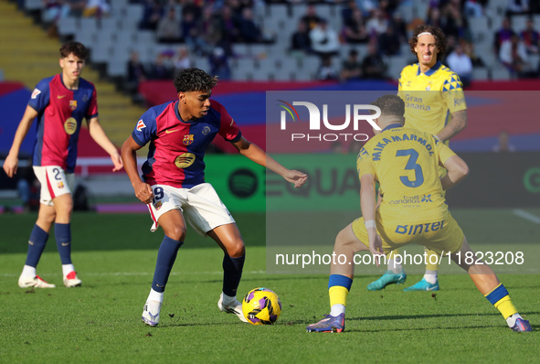 Lamine Yamal and Mika Marmol play during the match between FC Barcelona and UD Las Palmas, corresponding to week 15 of LaLiga EA Sports, at...