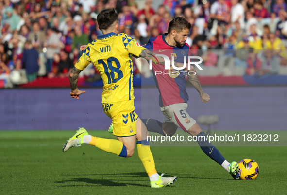 Inigo Martinez and Viti play during the match between FC Barcelona and UD Las Palmas, corresponding to week 15 of LaLiga EA Sports, at the L...