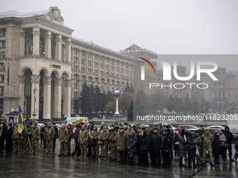 People attend a funeral ceremony for Ukrainian serviceman and founder of FC Obolon's ultras movement, Pavlo Vedybida, nicknamed ''Obolonchik...