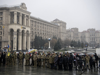 People attend a funeral ceremony for Ukrainian serviceman and founder of FC Obolon's ultras movement, Pavlo Vedybida, nicknamed ''Obolonchik...