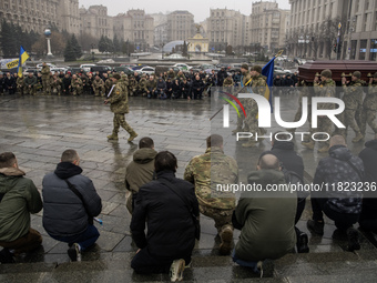 People attend a funeral ceremony for Ukrainian serviceman and founder of FC Obolon's ultras movement, Pavlo Vedybida, nicknamed ''Obolonchik...