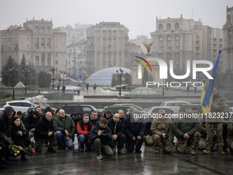 People attend a funeral ceremony for Ukrainian serviceman and founder of FC Obolon's ultras movement, Pavlo Vedybida, nicknamed ''Obolonchik...