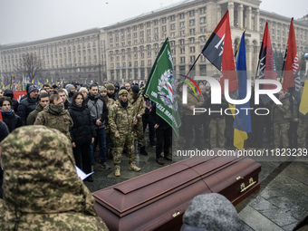 People attend a funeral ceremony for Ukrainian serviceman and founder of FC Obolon's ultras movement, Pavlo Vedybida, nicknamed ''Obolonchik...