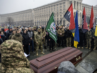 People attend a funeral ceremony for Ukrainian serviceman and founder of FC Obolon's ultras movement, Pavlo Vedybida, nicknamed ''Obolonchik...