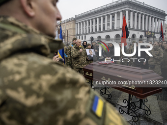 People attend a funeral ceremony for Ukrainian serviceman and founder of FC Obolon's ultras movement, Pavlo Vedybida, nicknamed ''Obolonchik...