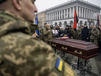 People attend a funeral ceremony for Ukrainian serviceman and founder of FC Obolon's ultras movement, Pavlo Vedybida, nicknamed ''Obolonchik...