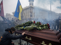 People attend a funeral ceremony for Ukrainian serviceman and founder of FC Obolon's ultras movement, Pavlo Vedybida, nicknamed ''Obolonchik...