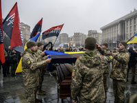 People attend a funeral ceremony for Ukrainian serviceman and founder of FC Obolon's ultras movement, Pavlo Vedybida, nicknamed ''Obolonchik...