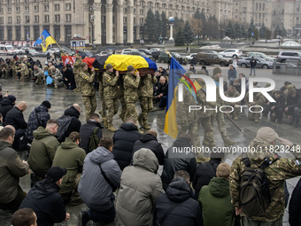 People attend a funeral ceremony for Ukrainian serviceman and founder of FC Obolon's ultras movement, Pavlo Vedybida, nicknamed ''Obolonchik...