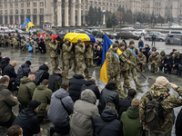 People attend a funeral ceremony for Ukrainian serviceman and founder of FC Obolon's ultras movement, Pavlo Vedybida, nicknamed ''Obolonchik...