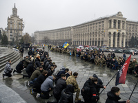 People attend a funeral ceremony for Ukrainian serviceman and founder of FC Obolon's ultras movement, Pavlo Vedybida, nicknamed ''Obolonchik...