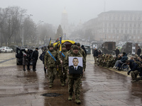 People attend a funeral service for Ukrainian serviceman and founder of FC Obolon's ultras movement, Pavlo Vedybida, nicknamed ''Obolonchik,...