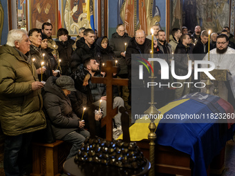 People attend a funeral service for Ukrainian serviceman and founder of FC Obolon's ultras movement, Pavlo Vedybida, nicknamed ''Obolonchik,...