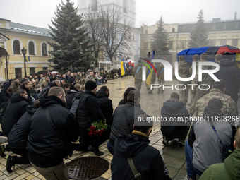 People attend a funeral service for Ukrainian serviceman and founder of FC Obolon's ultras movement, Pavlo Vedybida, nicknamed ''Obolonchik,...