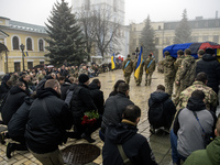 People attend a funeral service for Ukrainian serviceman and founder of FC Obolon's ultras movement, Pavlo Vedybida, nicknamed ''Obolonchik,...