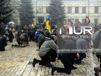 People attend a funeral service for Ukrainian serviceman and founder of FC Obolon's ultras movement, Pavlo Vedybida, nicknamed ''Obolonchik,...