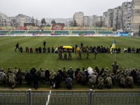 People attend a funeral ceremony for Ukrainian serviceman and founder of FC Obolon's ultras movement, Pavlo Vedybida, nicknamed ''Obolonchik...