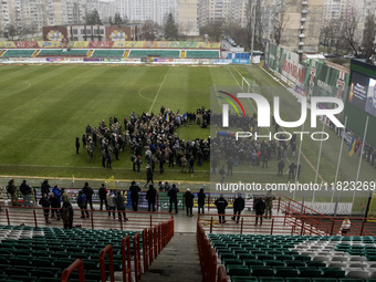 People attend a funeral ceremony for Ukrainian serviceman and founder of FC Obolon's ultras movement, Pavlo Vedybida, nicknamed ''Obolonchik...