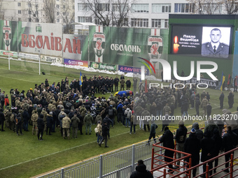 People attend a funeral ceremony for Ukrainian serviceman and founder of FC Obolon's ultras movement, Pavlo Vedybida, nicknamed ''Obolonchik...