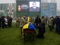 People attend a funeral ceremony for Ukrainian serviceman and founder of FC Obolon's ultras movement, Pavlo Vedybida, nicknamed ''Obolonchik...