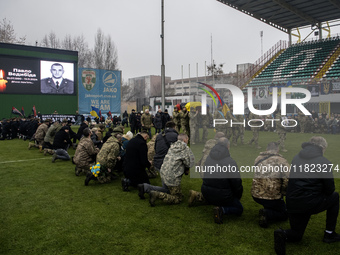 People attend a funeral ceremony for Ukrainian serviceman and founder of FC Obolon's ultras movement, Pavlo Vedybida, nicknamed ''Obolonchik...