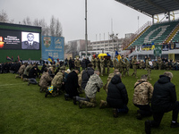 People attend a funeral ceremony for Ukrainian serviceman and founder of FC Obolon's ultras movement, Pavlo Vedybida, nicknamed ''Obolonchik...