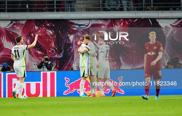 Kevin Behrens of VfL Wolfsburg  celebrates the teams fifth goal during the Bundesliga match between RB Leipzig and VfL Wolfsburg at Red Bull...