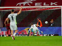 Kevin Behrens of VfL Wolfsburg  scores the teams fifth goal during the Bundesliga match between RB Leipzig and VfL Wolfsburg at Red Bull Are...