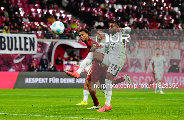 Lois Openda of RB Leipzig  shoots on goal during the Bundesliga match between RB Leipzig and VfL Wolfsburg at Red Bull Arena, Leipzig, Germa...