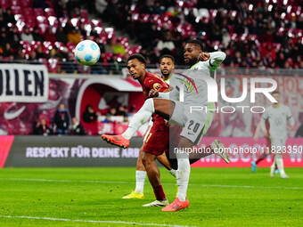 Lois Openda of RB Leipzig  shoots on goal during the Bundesliga match between RB Leipzig and VfL Wolfsburg at Red Bull Arena, Leipzig, Germa...