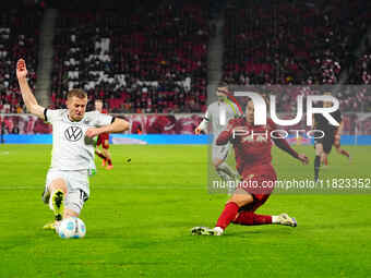 Antonio Nusa of RB Leipzig  controls the ball during the Bundesliga match between RB Leipzig and VfL Wolfsburg at Red Bull Arena, Leipzig, G...