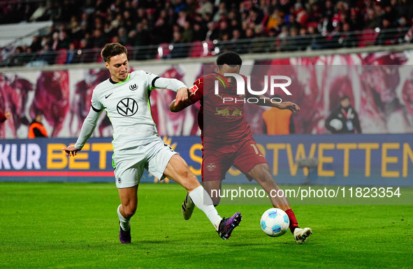 Lois Openda of RB Leipzig  controls the ball during the Bundesliga match between RB Leipzig and VfL Wolfsburg at Red Bull Arena, Leipzig, Ge...