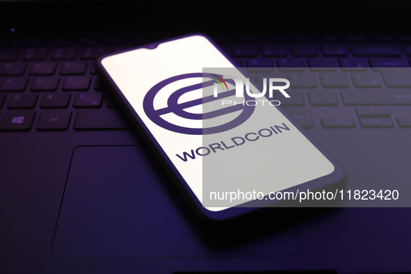 The Worldcoin logo appears on the screen of a smartphone in Reno, United States, on November 30, 2024. 