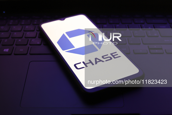 The Chase Bank logo appears on the screen of a smartphone in Reno, United States, on November 30, 2024. 