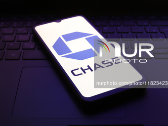 The Chase Bank logo appears on the screen of a smartphone in Reno, United States, on November 30, 2024. (