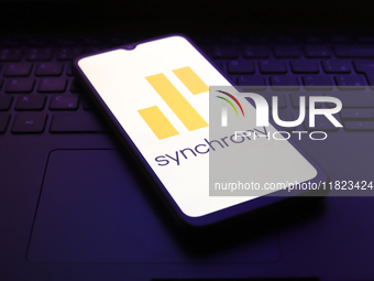 The Synchrony logo appears on the screen of a smartphone in Reno, United States, on November 30, 2024. (