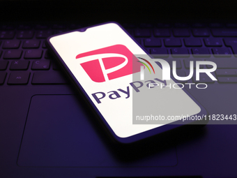 The PayPay logo appears on the screen of a smartphone in Reno, United States, on November 30, 2024. (