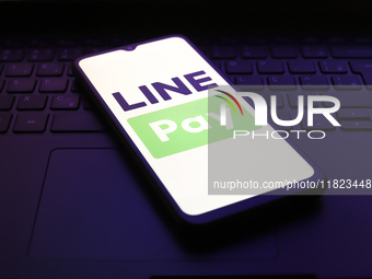 The LINE Pay logo appears on the screen of a smartphone in Reno, United States, on November 30, 2024. (