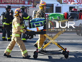 Large fire affects a strip mall in the Rego Park section of Queens, New York, United States on November 30, 2024. Around 11:00 am, Saturday...