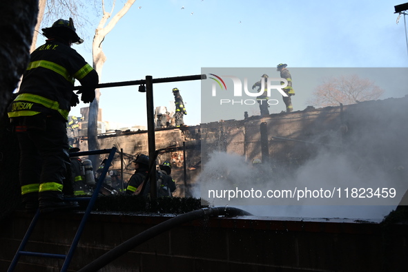 Large fire affects a strip mall in the Rego Park section of Queens, New York, United States on November 30, 2024. Around 11:00 am, Saturday...