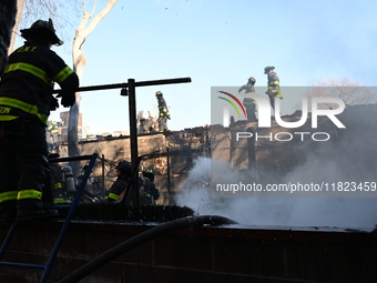 Large fire affects a strip mall in the Rego Park section of Queens, New York, United States on November 30, 2024. Around 11:00 am, Saturday...