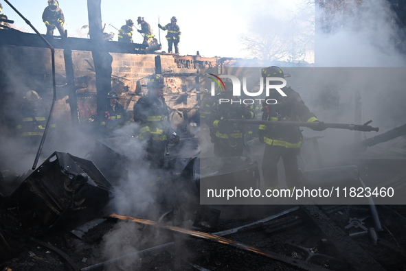 Large fire affects a strip mall in the Rego Park section of Queens, New York, United States on November 30, 2024. Around 11:00 am, Saturday...