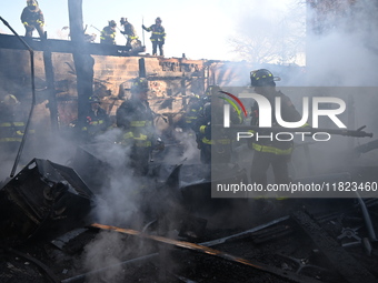 Large fire affects a strip mall in the Rego Park section of Queens, New York, United States on November 30, 2024. Around 11:00 am, Saturday...