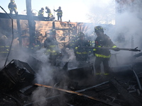 Large fire affects a strip mall in the Rego Park section of Queens, New York, United States on November 30, 2024. Around 11:00 am, Saturday...