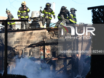 Large fire affects a strip mall in the Rego Park section of Queens, New York, United States on November 30, 2024. Around 11:00 am, Saturday...