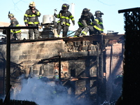 Large fire affects a strip mall in the Rego Park section of Queens, New York, United States on November 30, 2024. Around 11:00 am, Saturday...