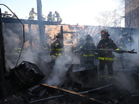 Large fire affects a strip mall in the Rego Park section of Queens, New York, United States on November 30, 2024. Around 11:00 am, Saturday...