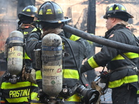 Large fire affects a strip mall in the Rego Park section of Queens, New York, United States on November 30, 2024. Around 11:00 am, Saturday...